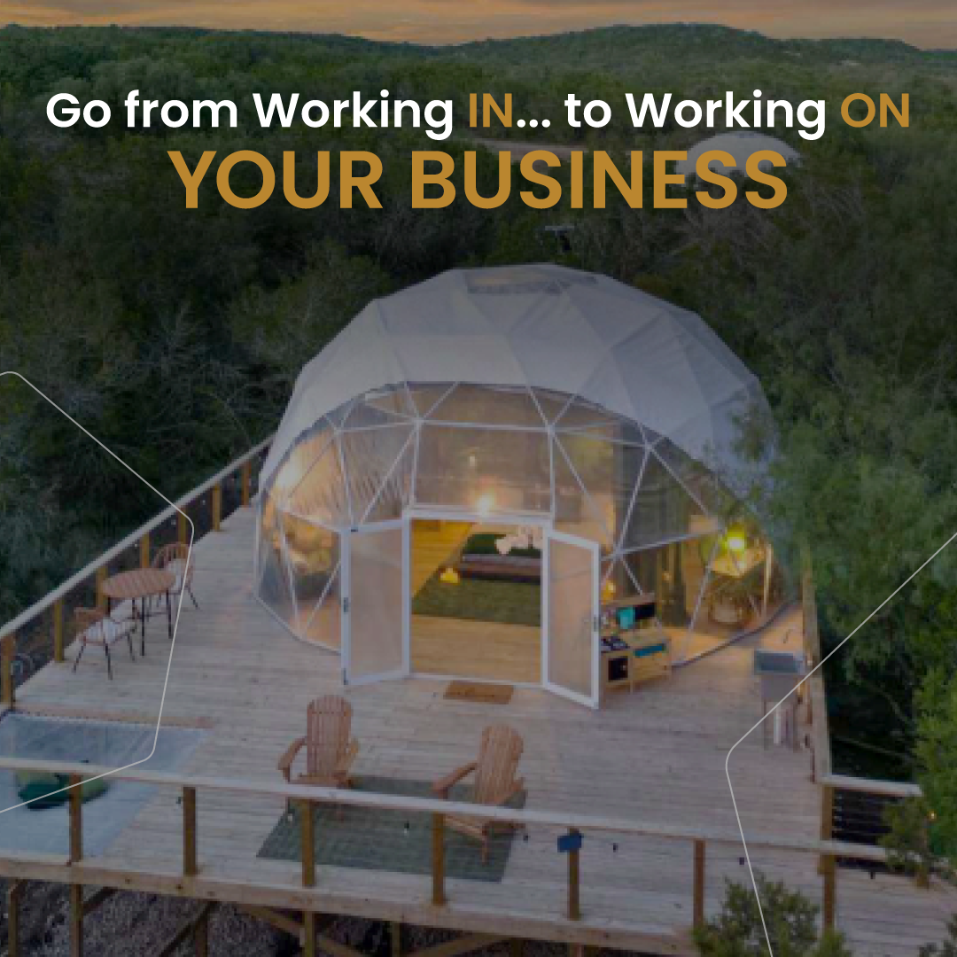 An aerial view of a dome on a wooden deck with the words go from working in to working on your business