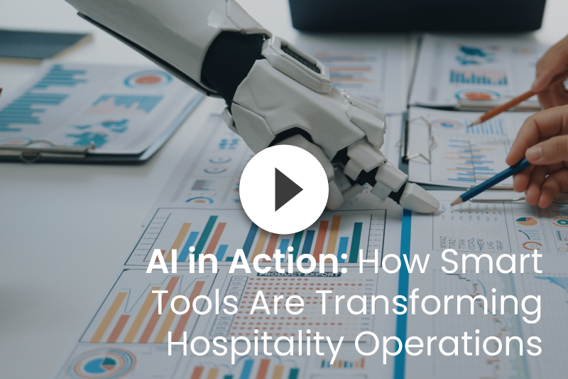 Robot hand analyzing charts alongside human hands. Headline: AI in Action: Hospitality operations transformation.