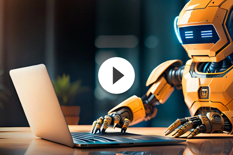 A robot is using a laptop computer on a table.