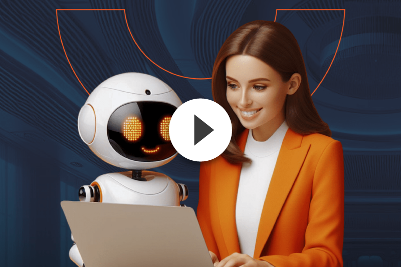 A woman is sitting next to a robot while using a laptop.
