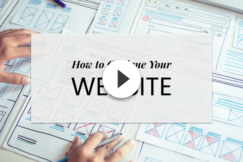 A person is holding a card that says how to create your website