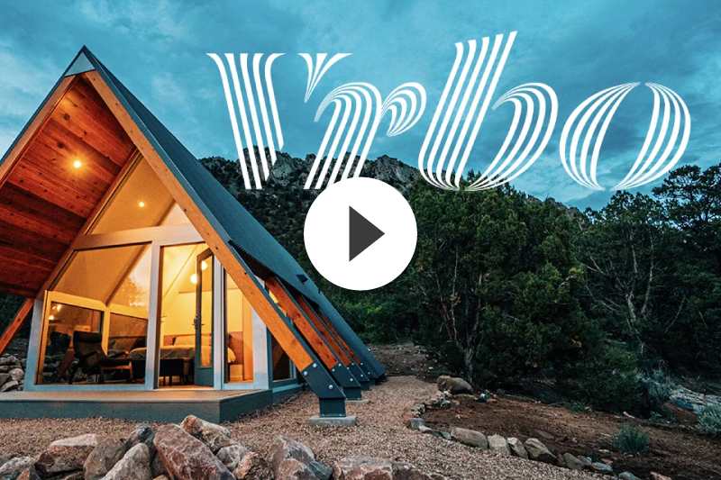 A picture of a house with the VRBO Logo.