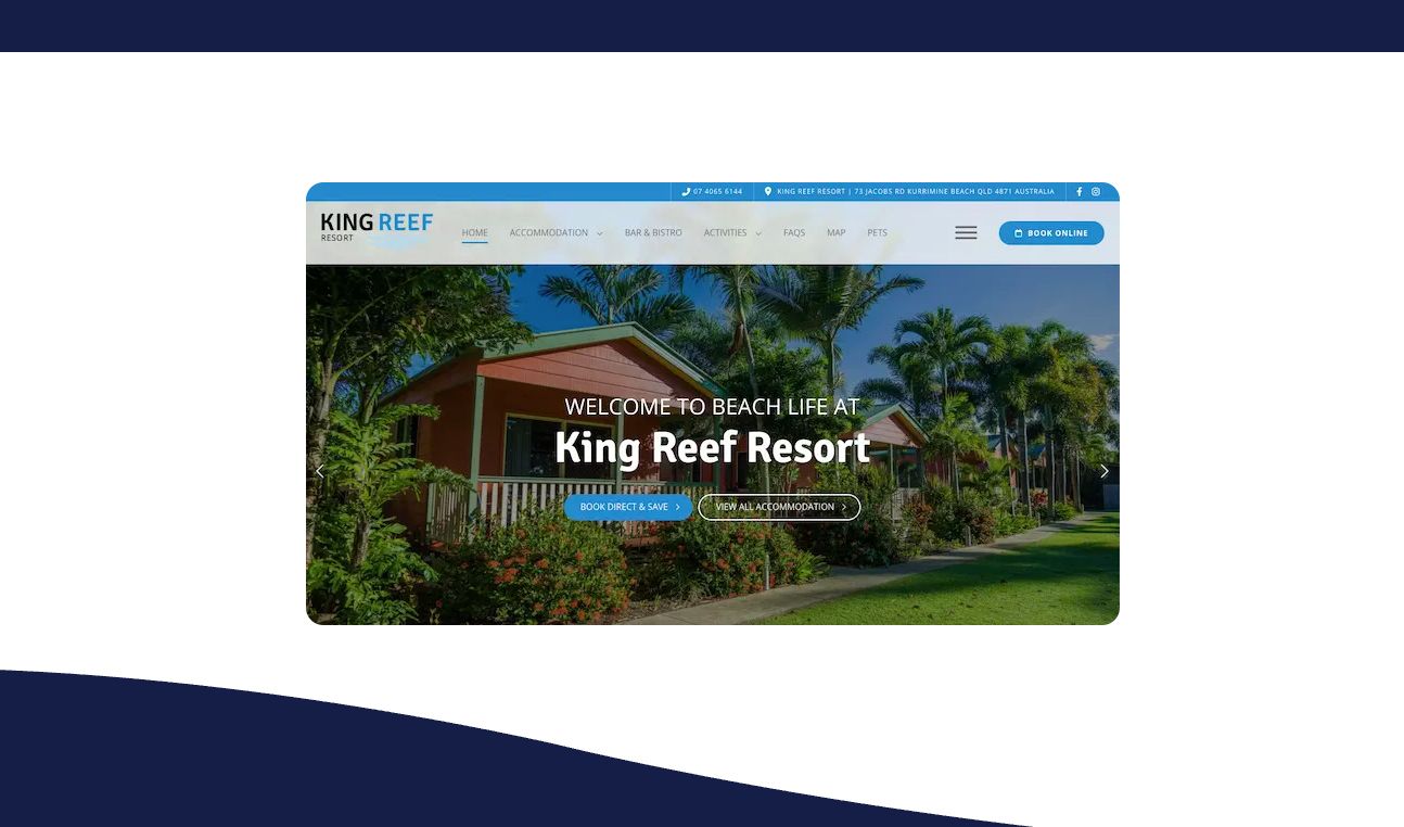 The website for king reef resort shows a picture of a house surrounded by trees.