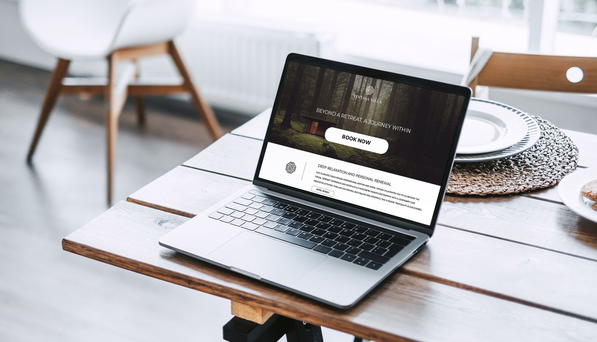 A laptop computer is sitting on a wooden table.