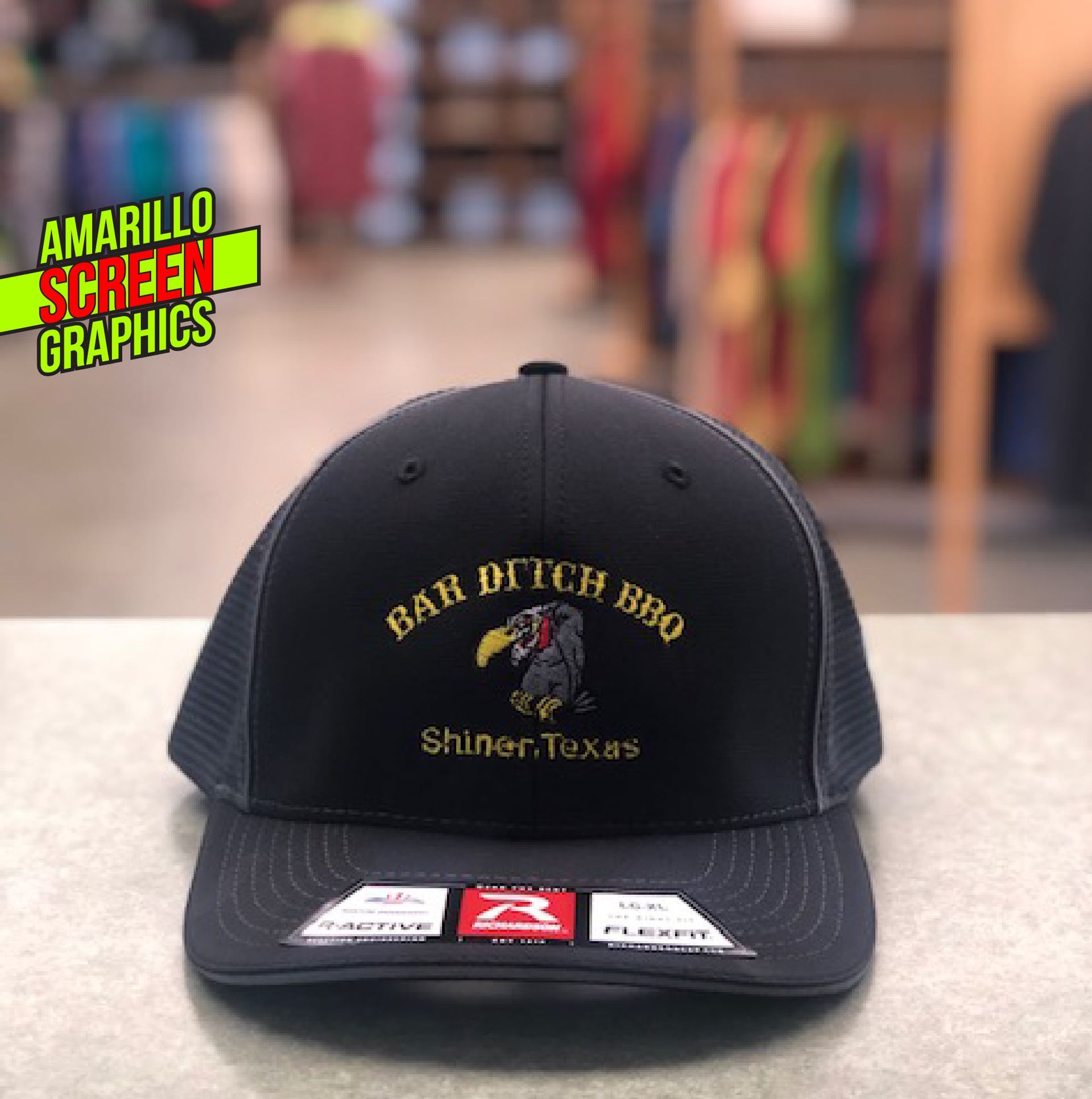 A baseball cap that says bar pitch bbq shiner texas