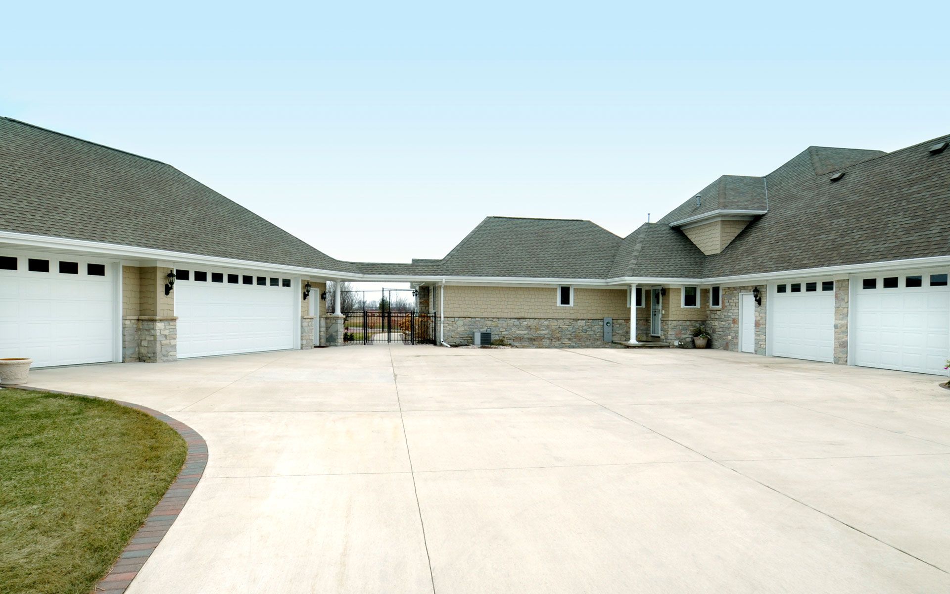 A large house with a lot of garage doors