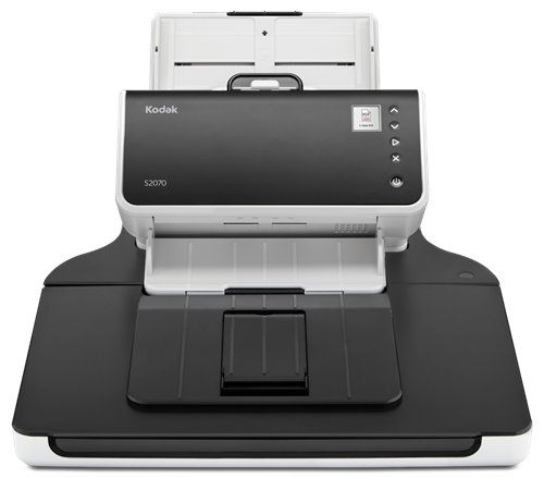 Un escáner en blanco y negro está colocado encima de una mesa.