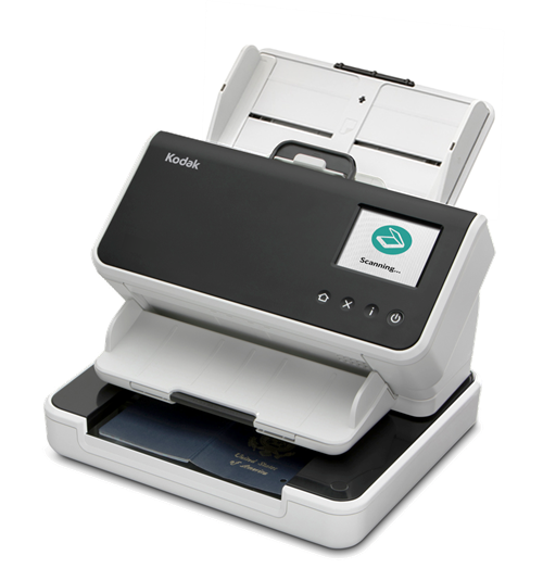 Un escáner Kodak en blanco y negro está sentado sobre una superficie blanca