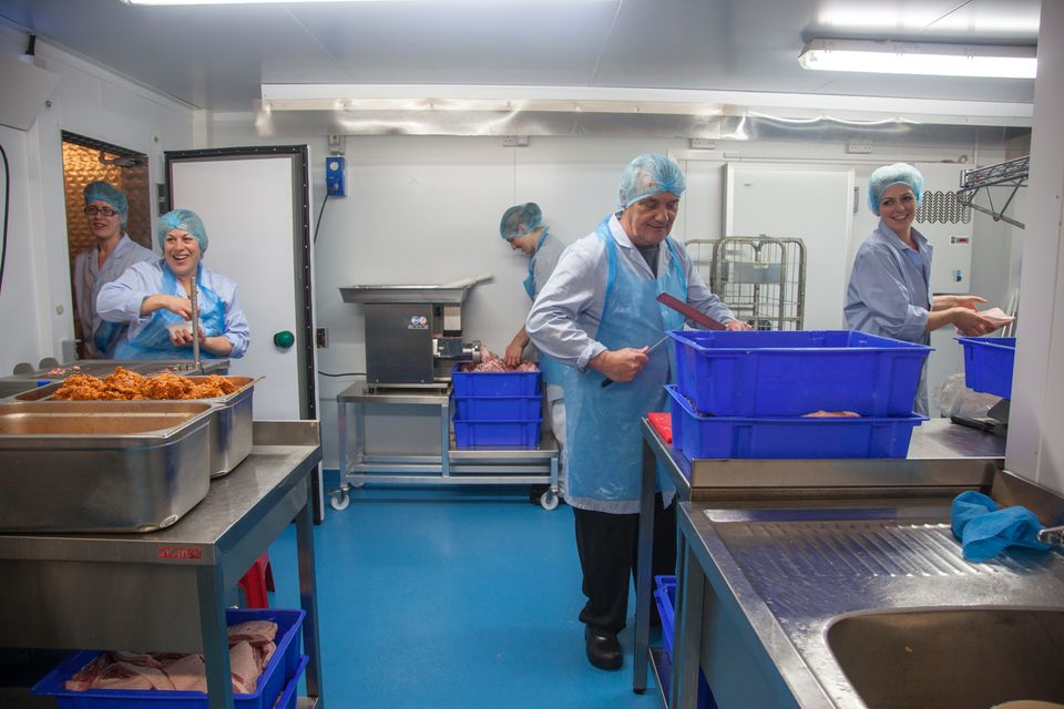 The team at Deli Farm all working in their small factory, in order produce some of their special christmas Salami. Delabole, Cornwall.  17.11.15