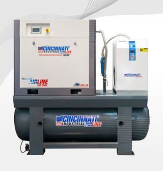 Unidad compresora de aire Cincinnati Industrial Airline. Blanca, gris y azul, montada sobre un tanque.