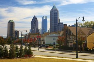 Houses and cars against the midtown. Atlanta, GA. USA.