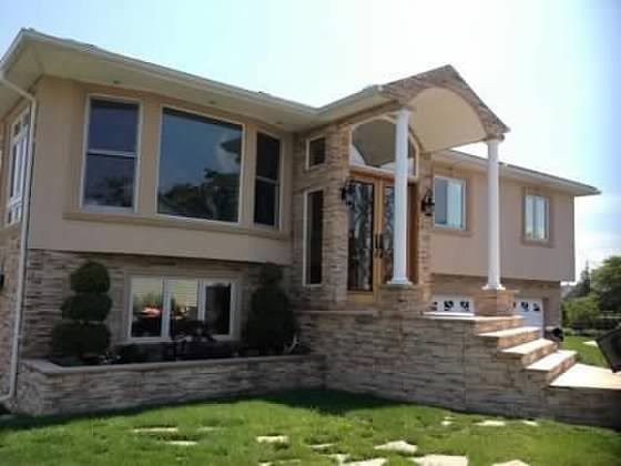 Two Story Home with Decorative Entry Stairs