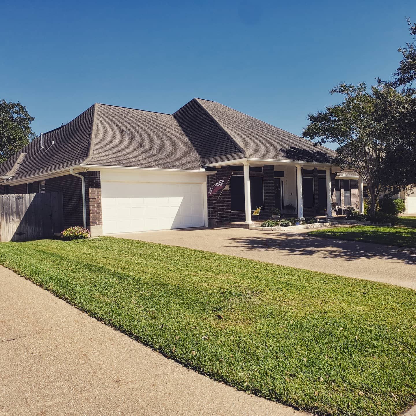 A house with a white garage door and a porch