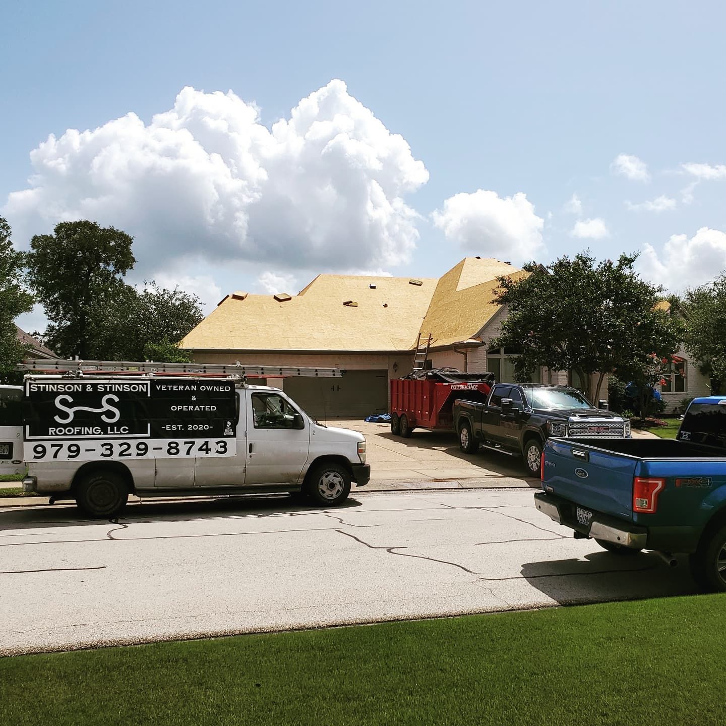 A s-s truck is parked in front of a house