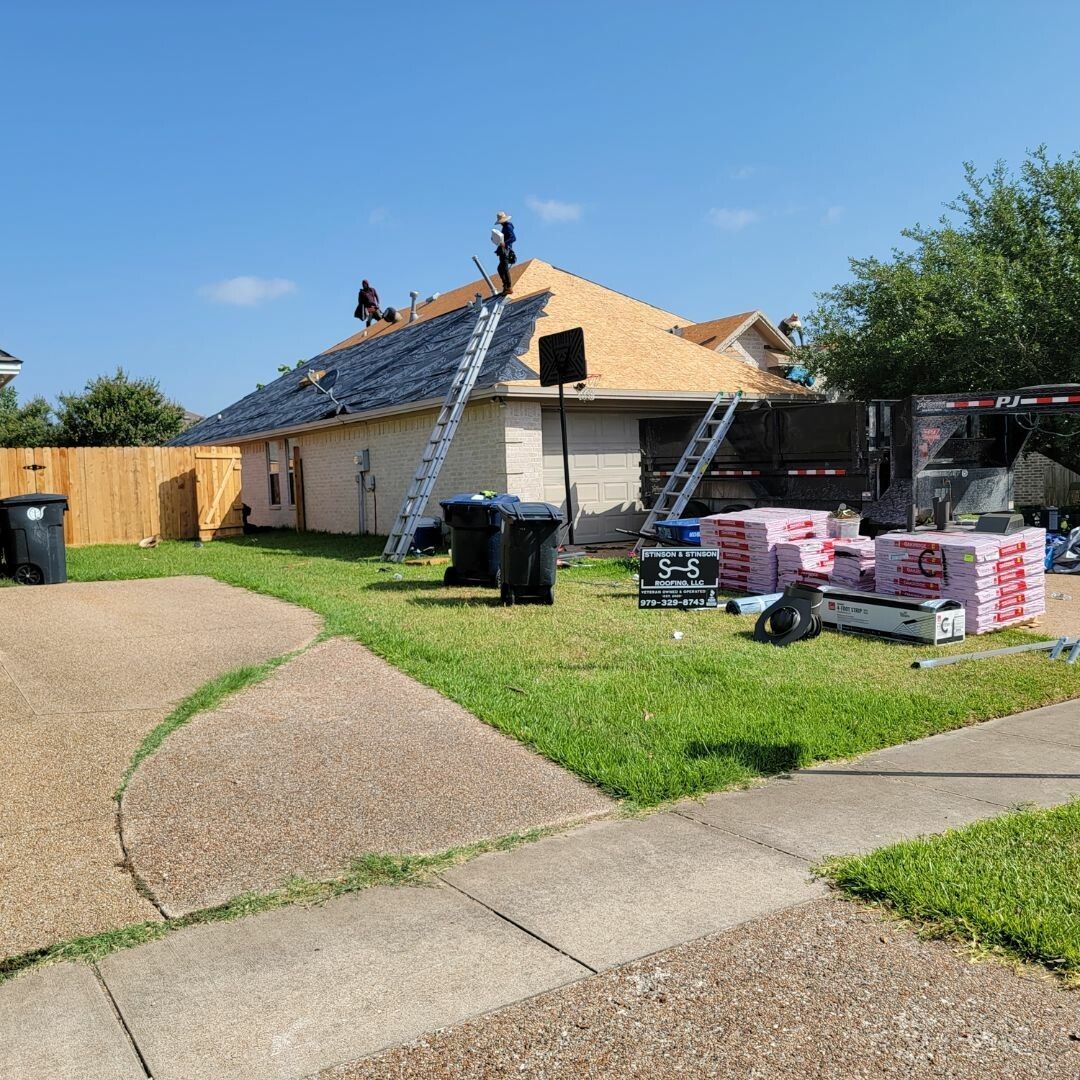 A house is being remodeled with solar panels on the roof.