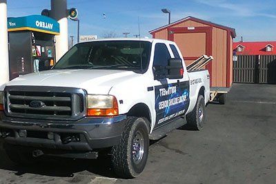 truck moving a shed