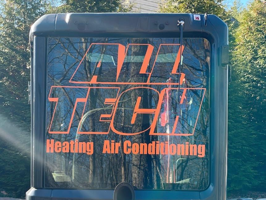 A sign that says heating air conditioning on it