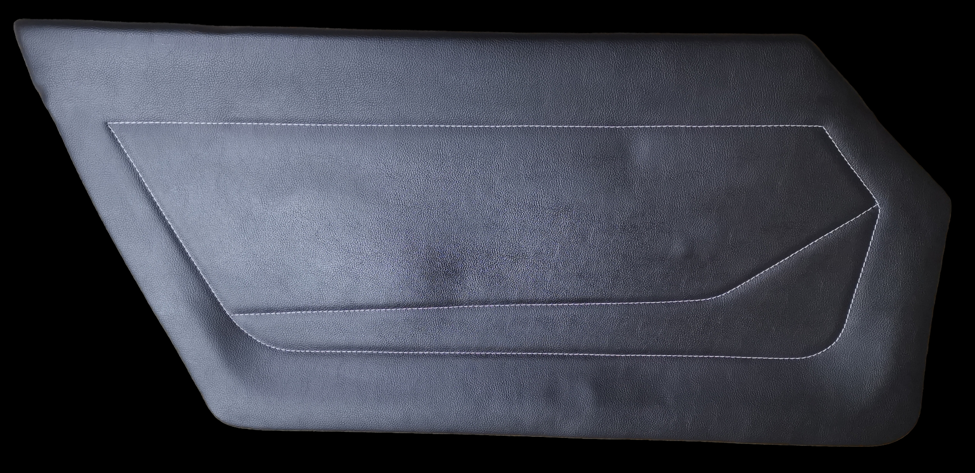 Dark gray, textured car door panel with a rectangular and angled design.
