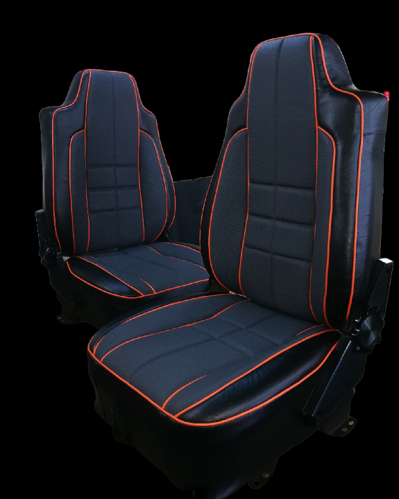 Black car seats with orange stitching.