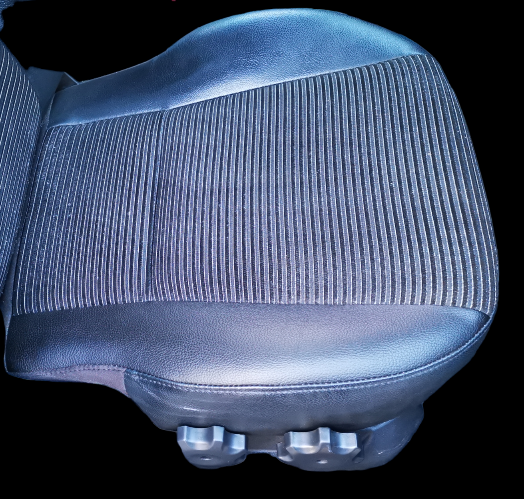 Black car seat with ribbed fabric and leather trim.