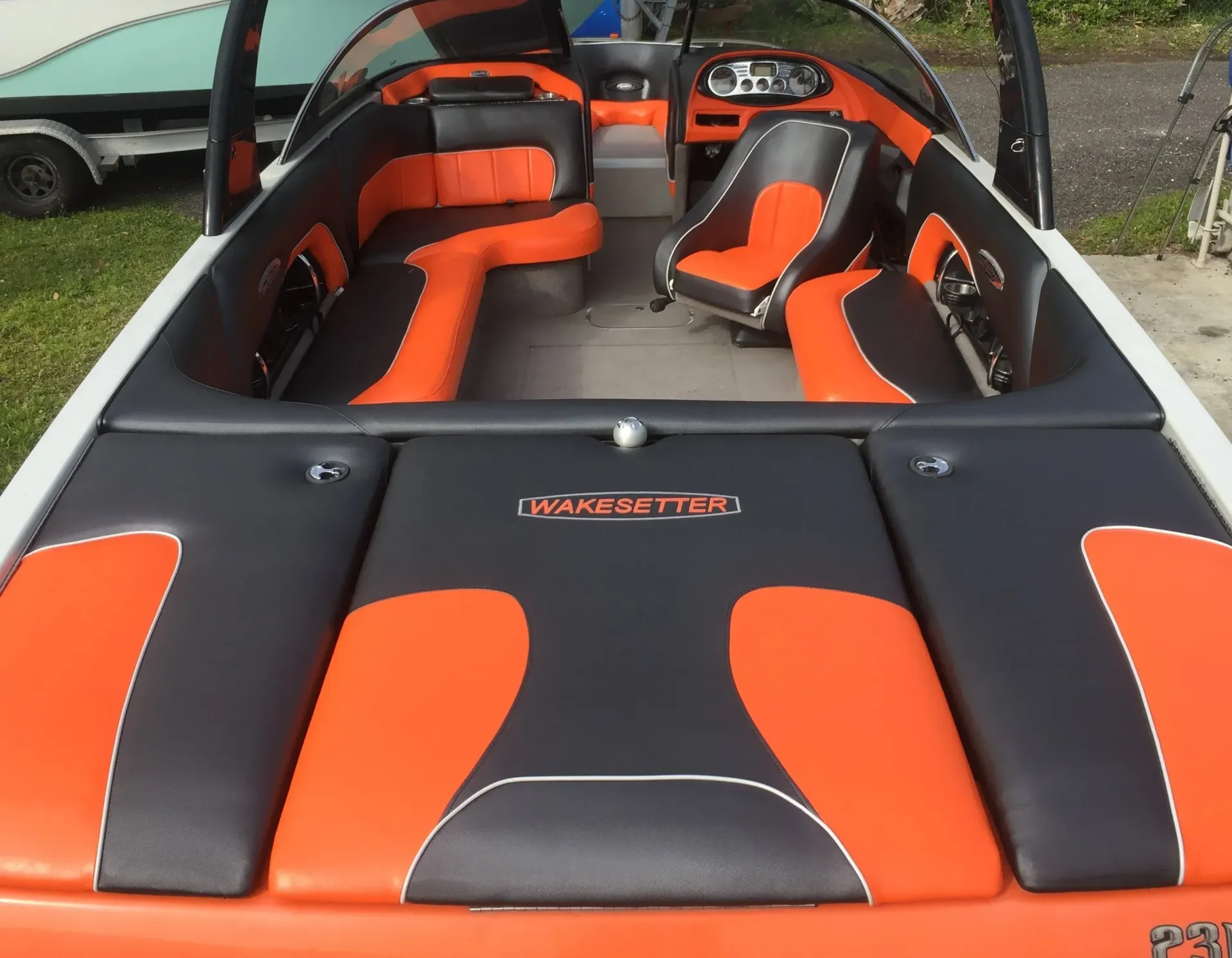 Cream-colored sectional sofa with striped pillows and a dark wooden coffee table.