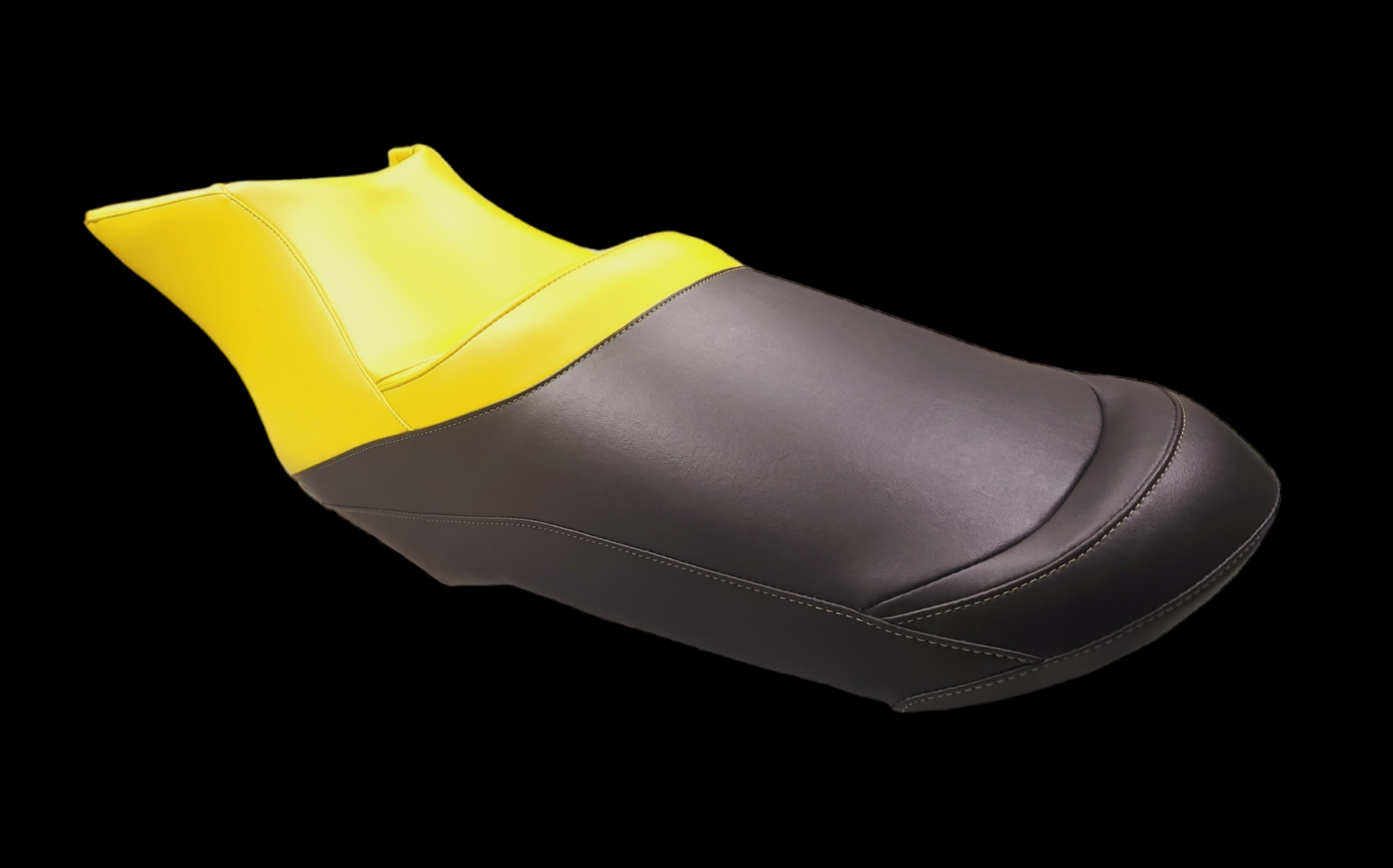Yellow and black bicycle saddle, designed for comfort, on a black background.