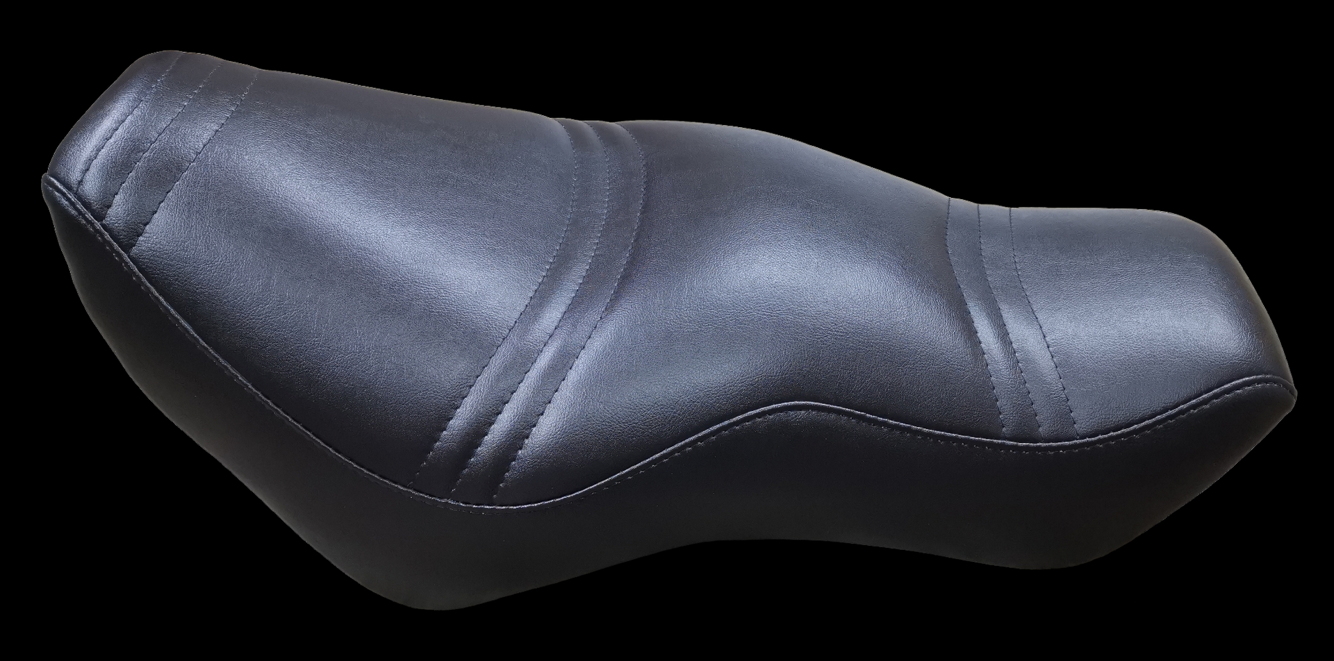Black motorcycle seat with stitched detailing.