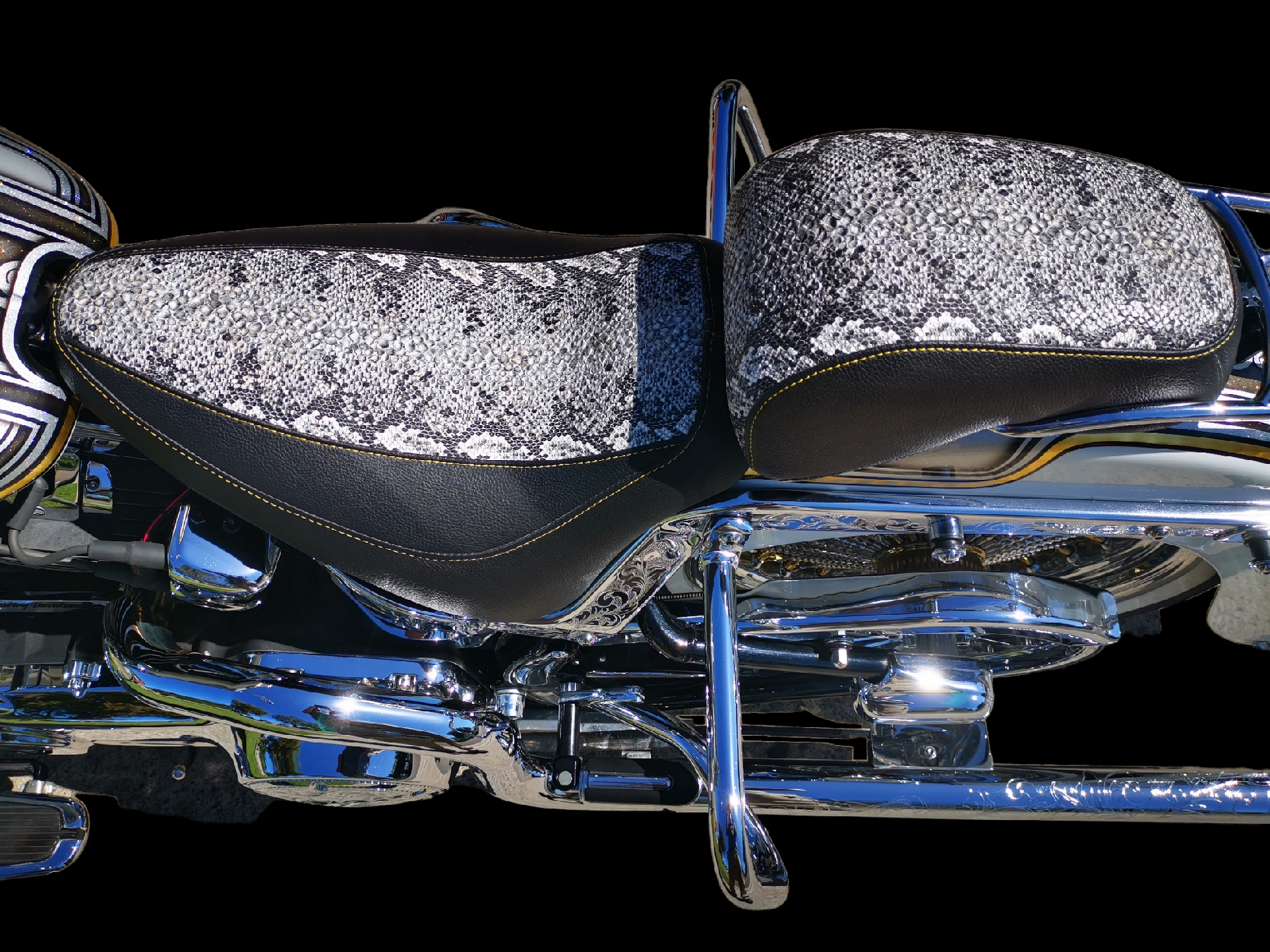 Black motorcycle seat with diamond stitching, and a matching passenger backrest.