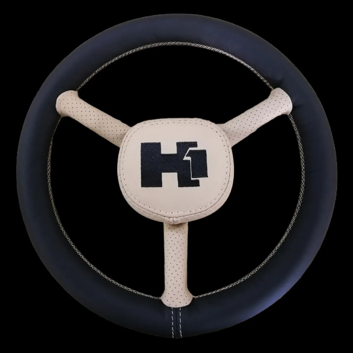 Black steering wheel with a triangular center.
