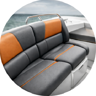 Black motorcycle seat with backrest, featuring stitched details.