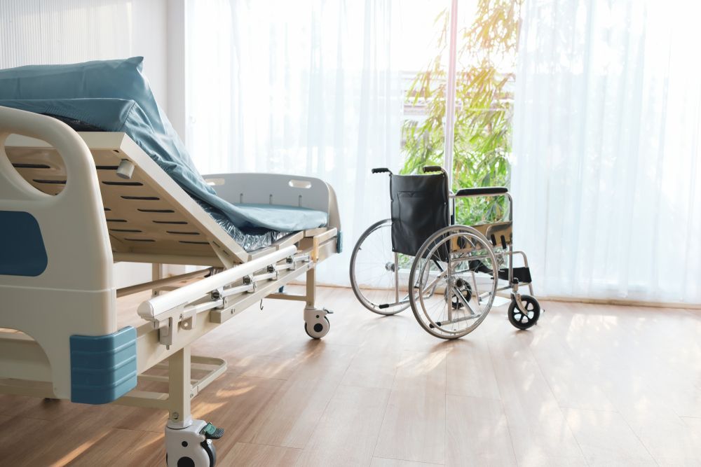 Hospital Room With Adjustable Bed, Wheelchair, and Window — Ballina Home Healthcare Sales & Hire and Compression Stockings Plus in Ballina, NSW
