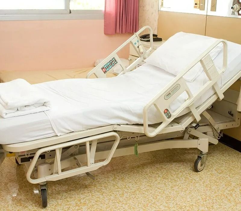 Hospital Bed in a Room With a White Bedsheet and Pillow — Ballina Home Healthcare Sales & Hire and Compression Stockings Plus in Ballina, NSW
