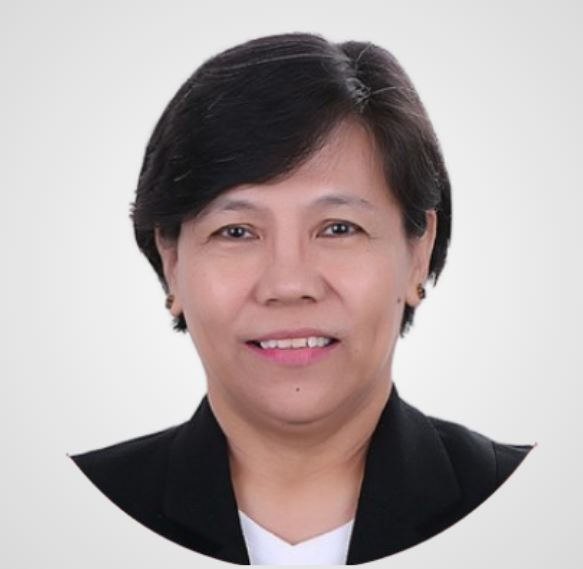 Woman with short black hair, smiling, wearing a black suit jacket.