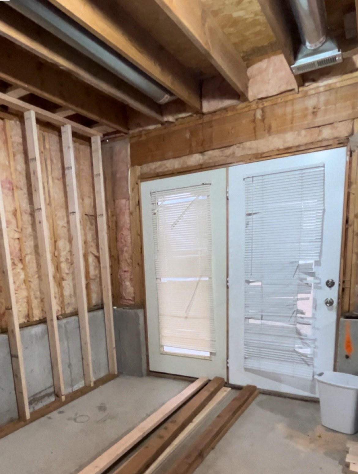 A room with a door and a window in it