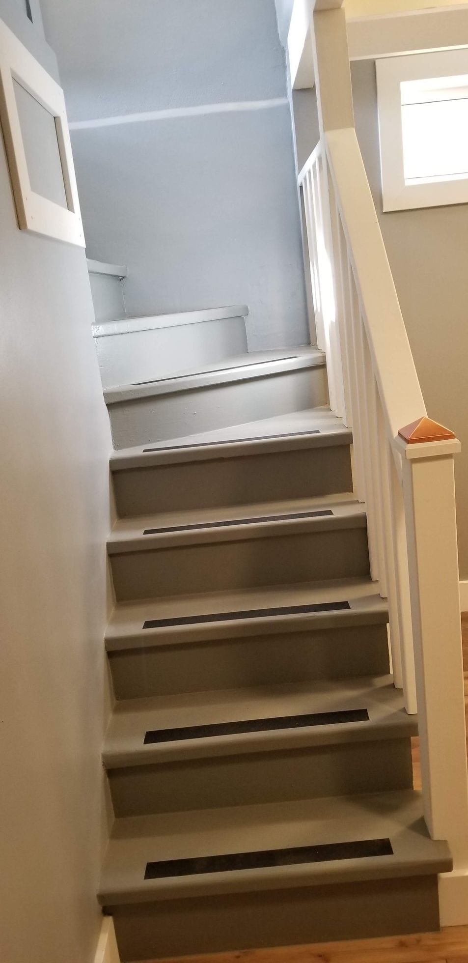 A set of stairs leading up to the second floor of a house.