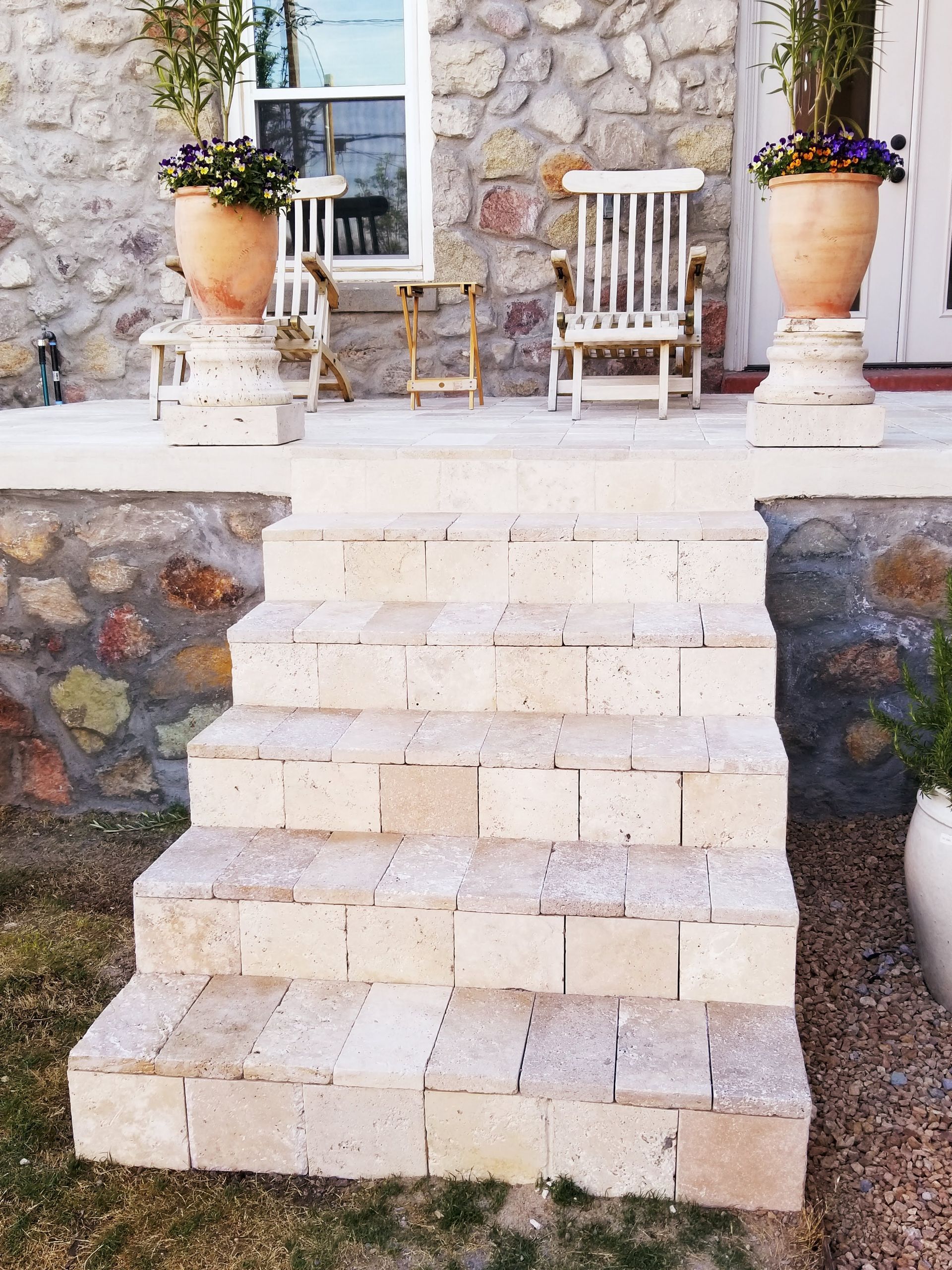 A set of stairs leading up to a stone building