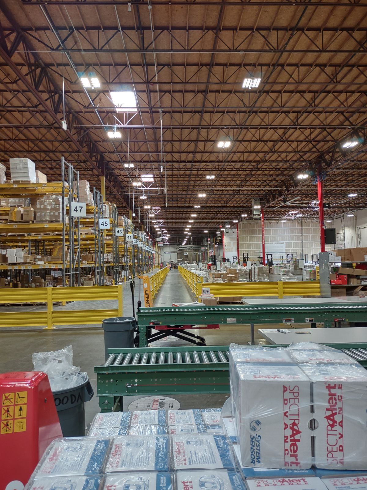 A large warehouse filled with lots of boxes and shelves.