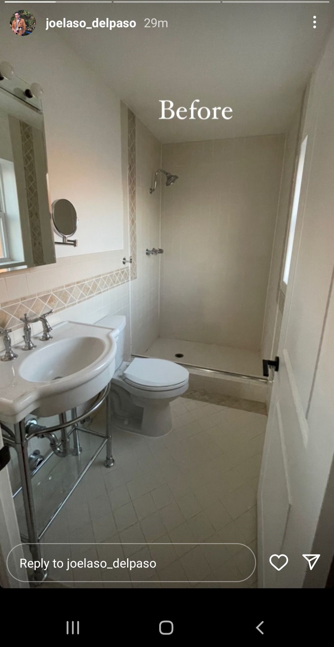 A bathroom with a sink , toilet , shower and mirror.