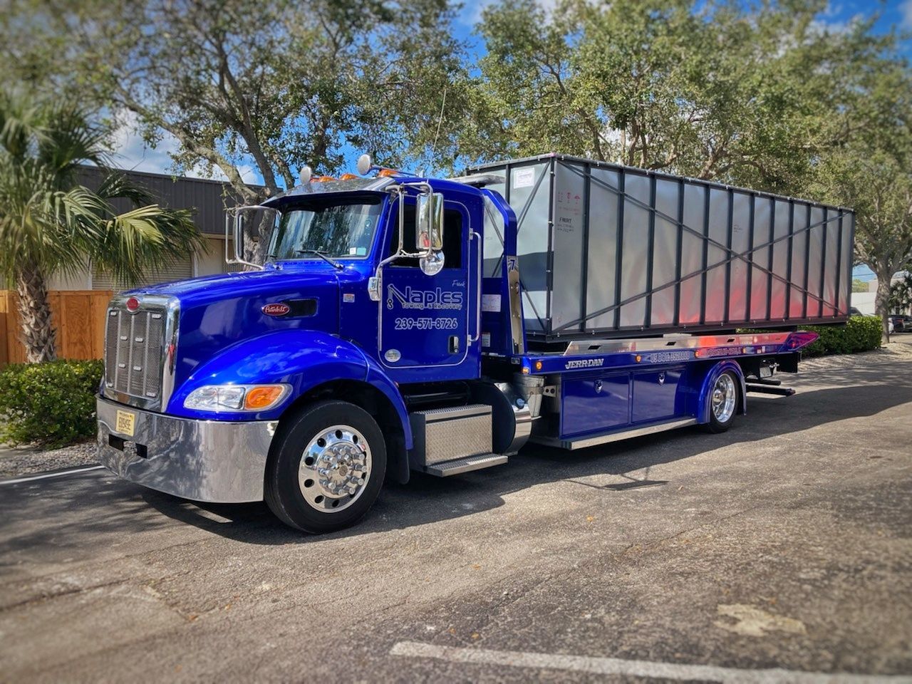 Efficient large container hauling services provided by Naples Towing and Recovery in Naples, FL