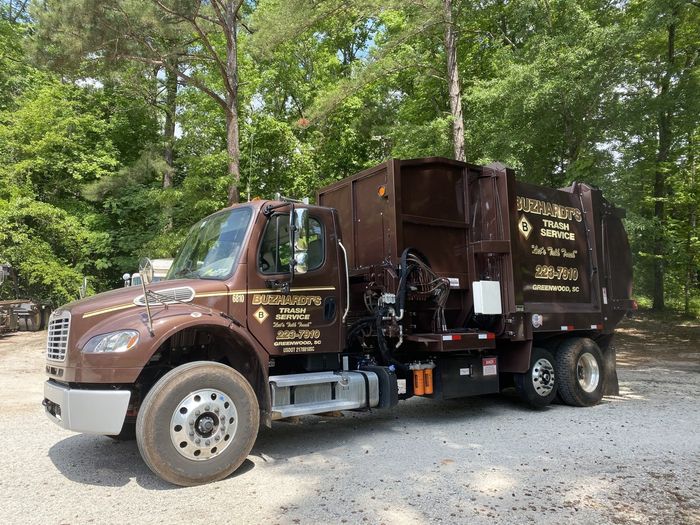 Green Trash Collector Truck — Greenwood, SC — Buzhardt Trash Service