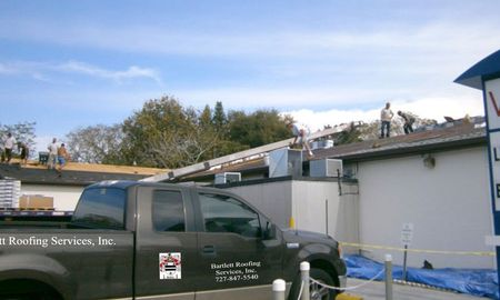 Compny Car in front of a House — Port Richey, FL — Bartlett Roofing Services, Inc.