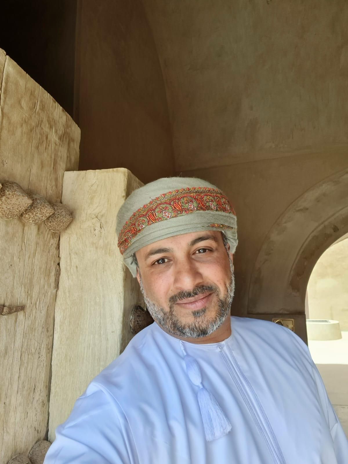 Ahmed - The Local Lynx - in Turban and Dishdasha at Jabreen Castle Oman