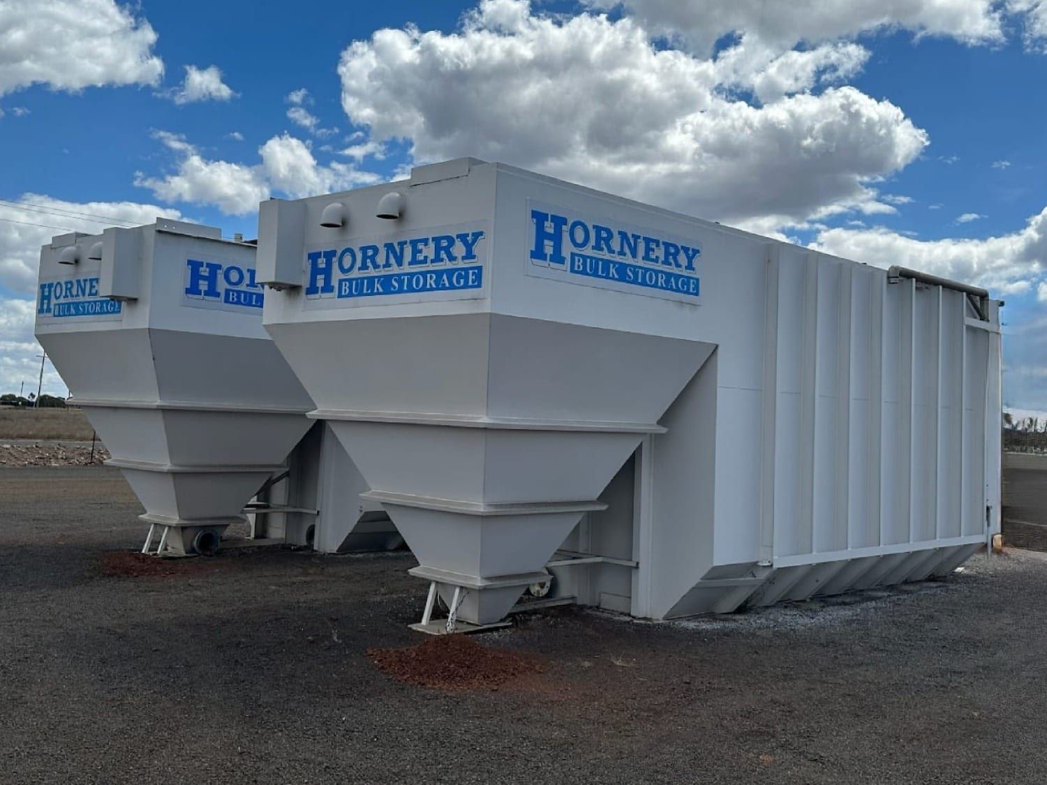a row of white containers with hornery written on them