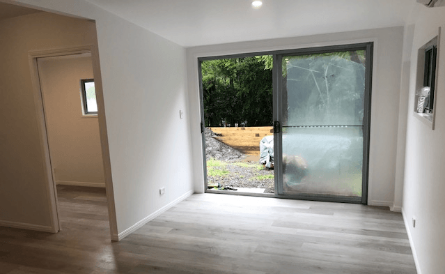 A Handyman Setting Up A Cabinet — Property Maintenance & Garden Care in Beerwah, QLD