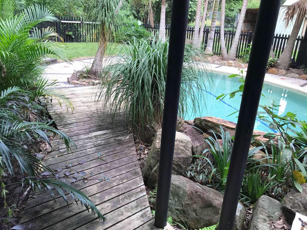 Before Wooden Pathway Goint To Swimming Pool — Property Maintenance & Garden Care in Beerwah, QLD