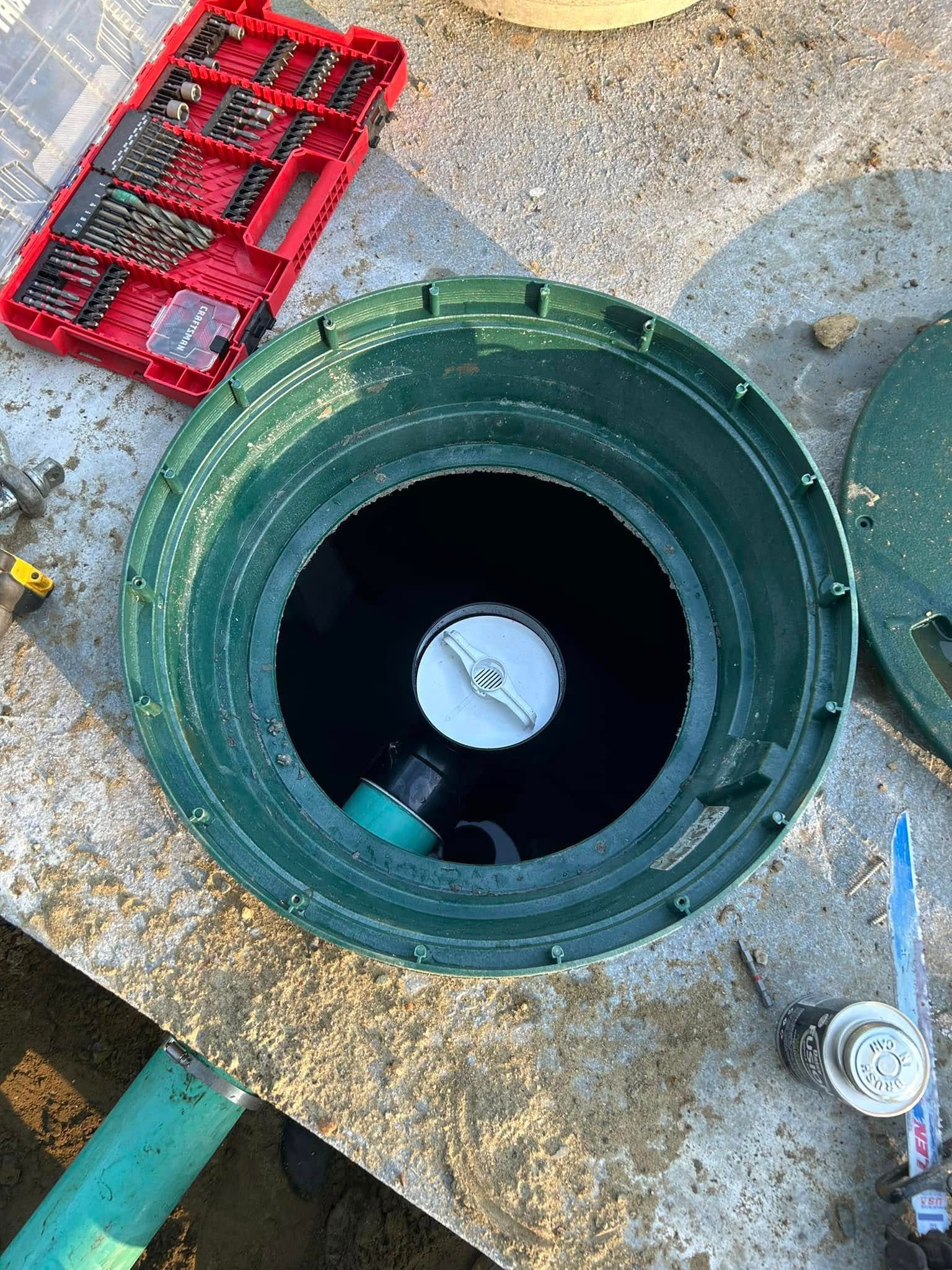 A green bucket with a white lid is sitting on top of a table.