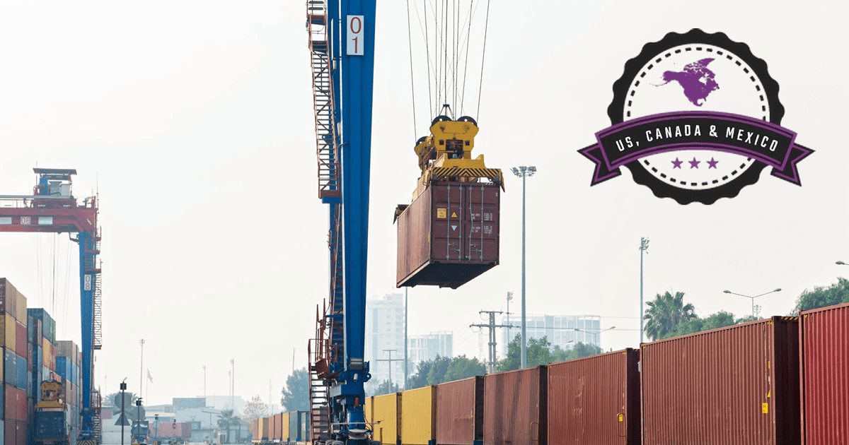 A crane is lifting a shipping container onto a train.