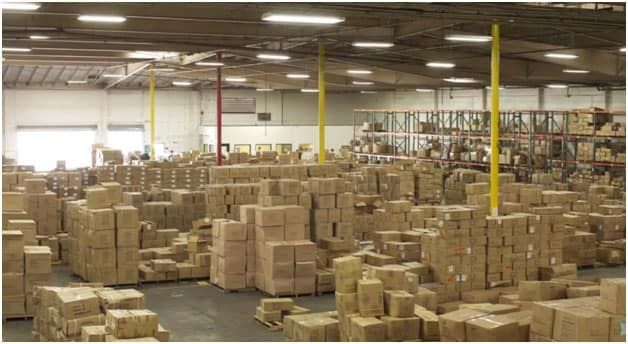 A large warehouse filled with lots of cardboard boxes