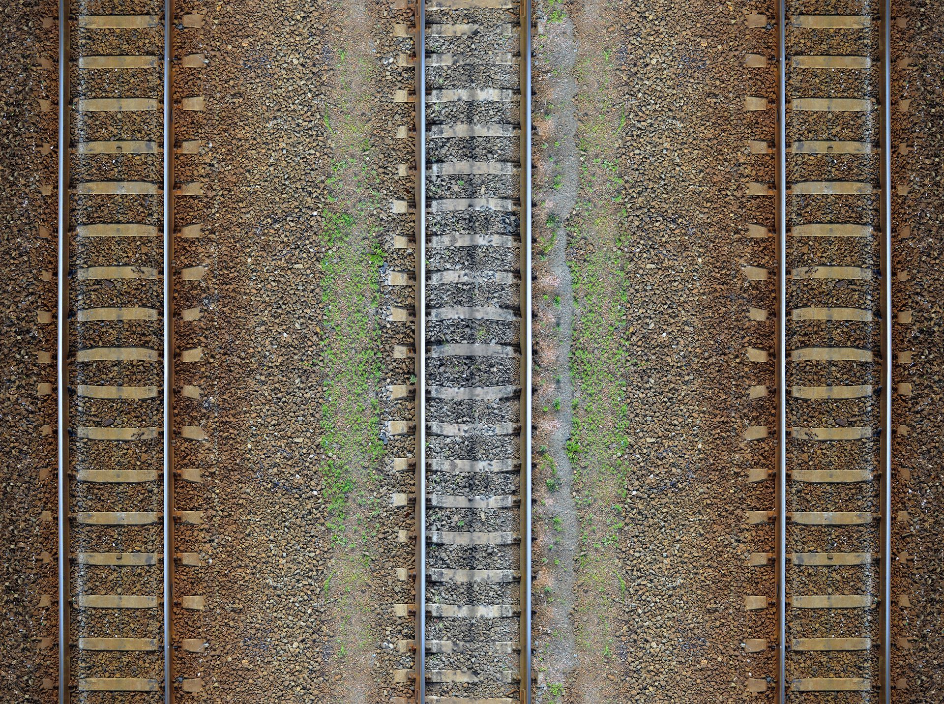 A close up of train tracks on a gravel road.