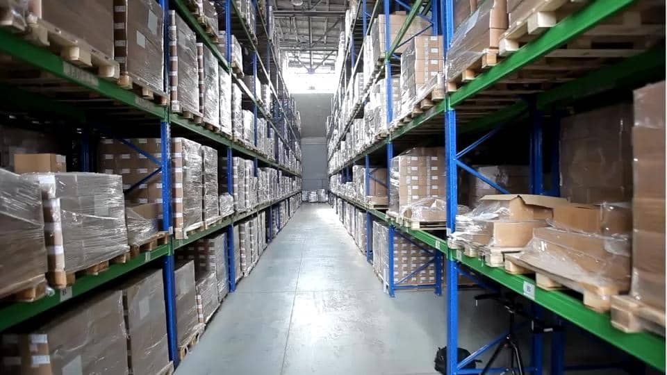 A warehouse filled with lots of boxes and shelves.